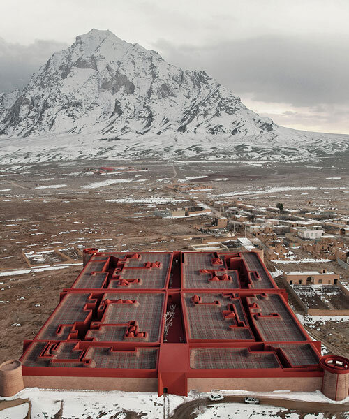 kalbod reimagines ernan castle in iran as boutique hotel enclosed in red textured walls